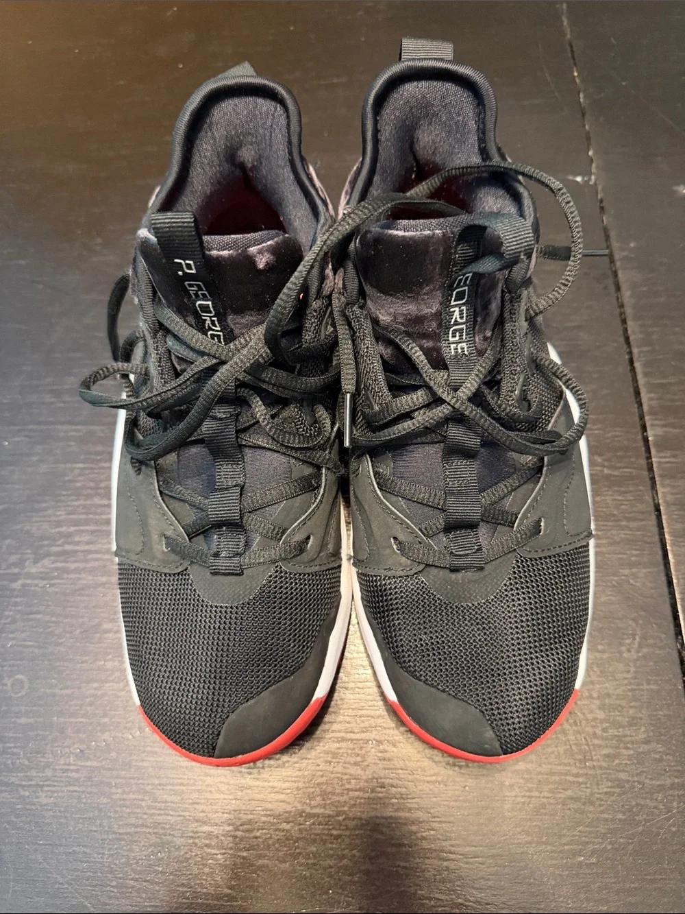 Nike Kids Black Sneakers with Red Toe Accent